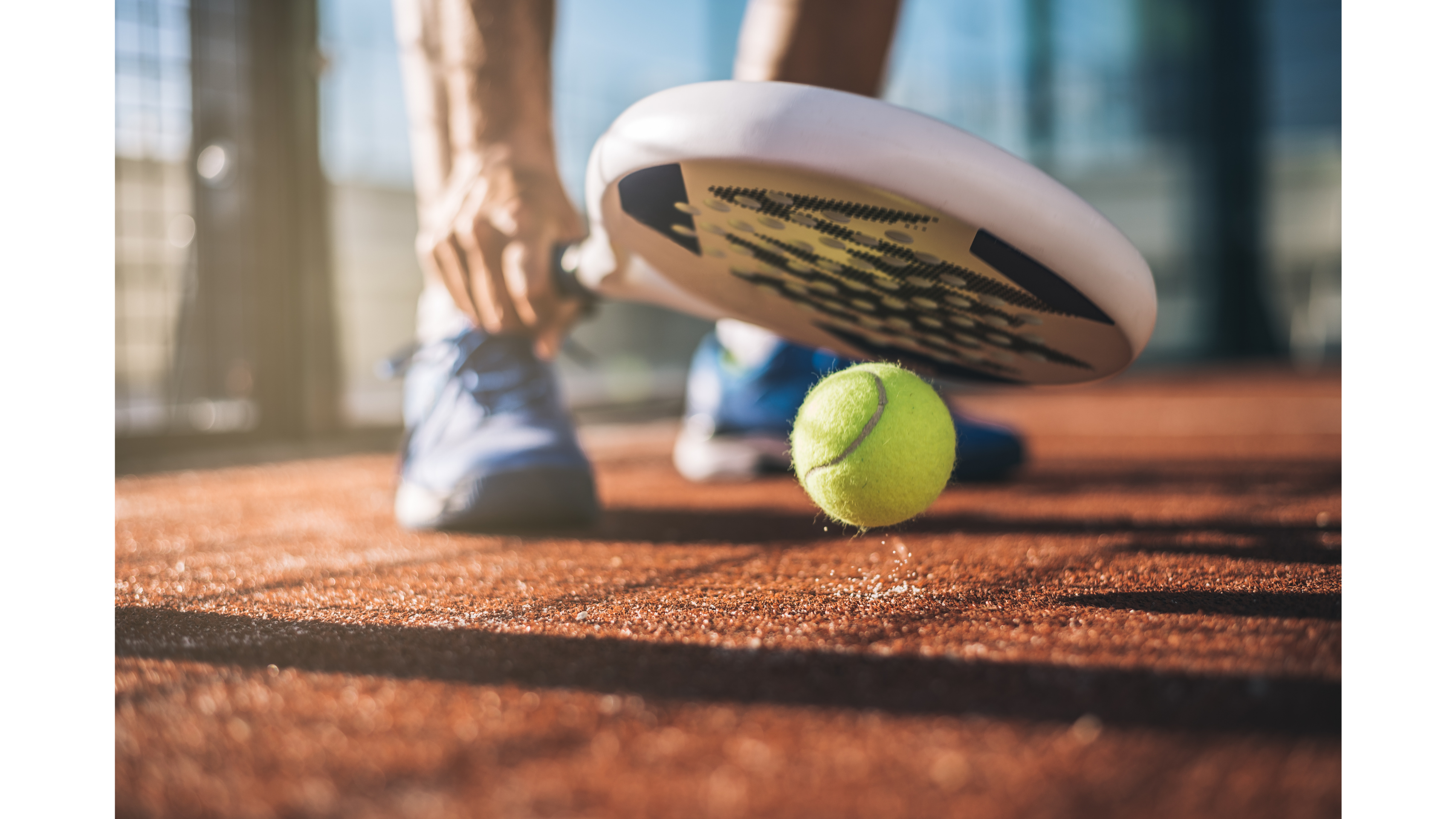 Close-up of a padel racket on court